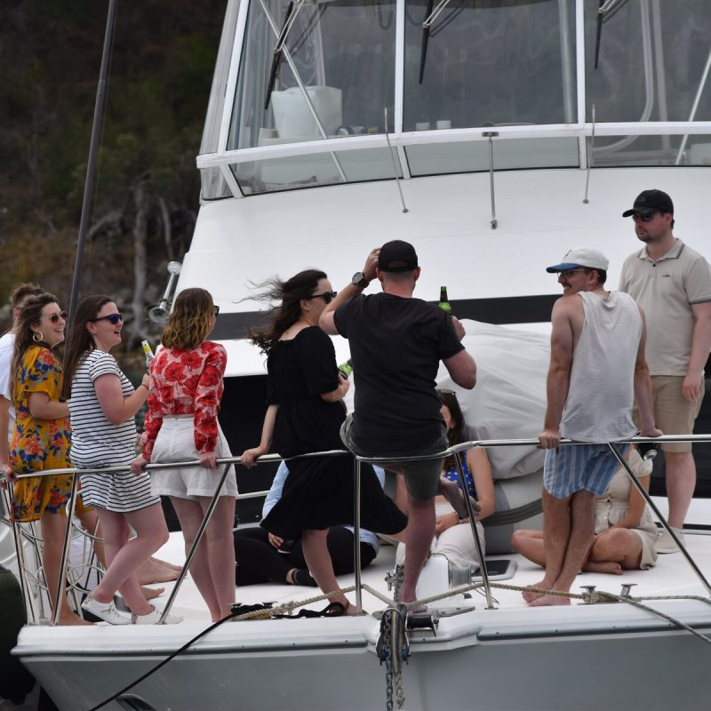 People on a boat enjoying a drink